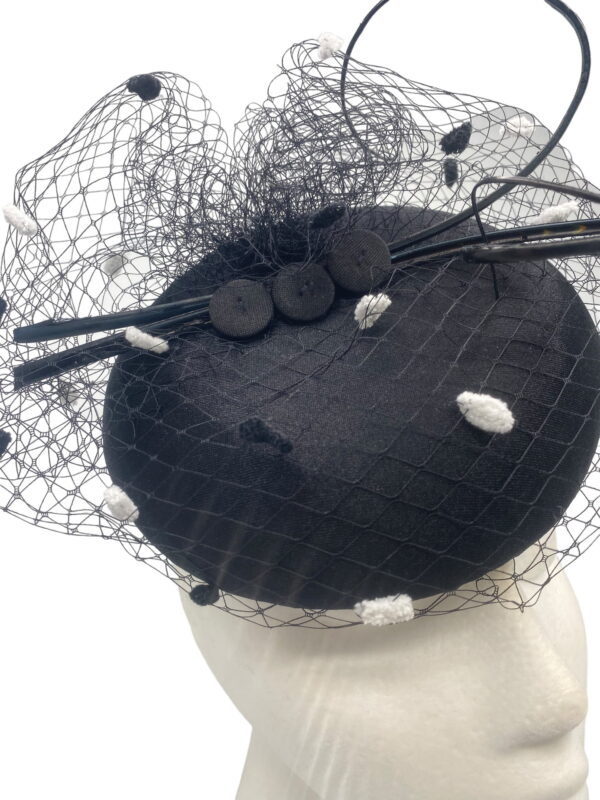 Stunning simple litlle black pillbox with gorgeous monochrome pompom veiling overlay.